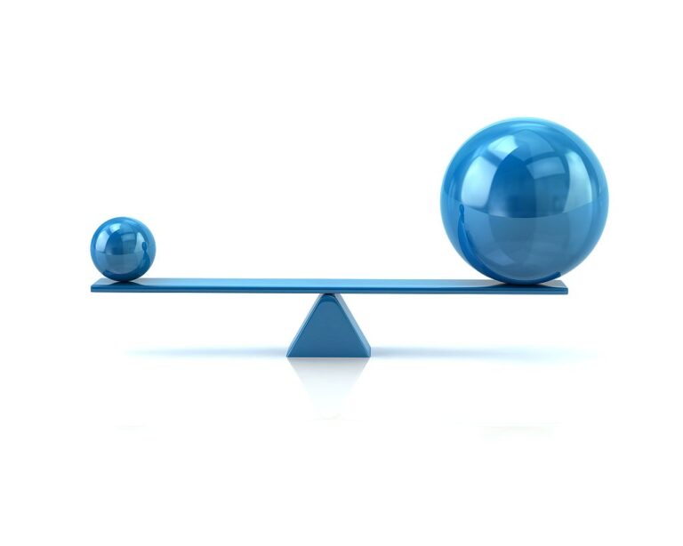 Different blue spheres balancing on a seesaw